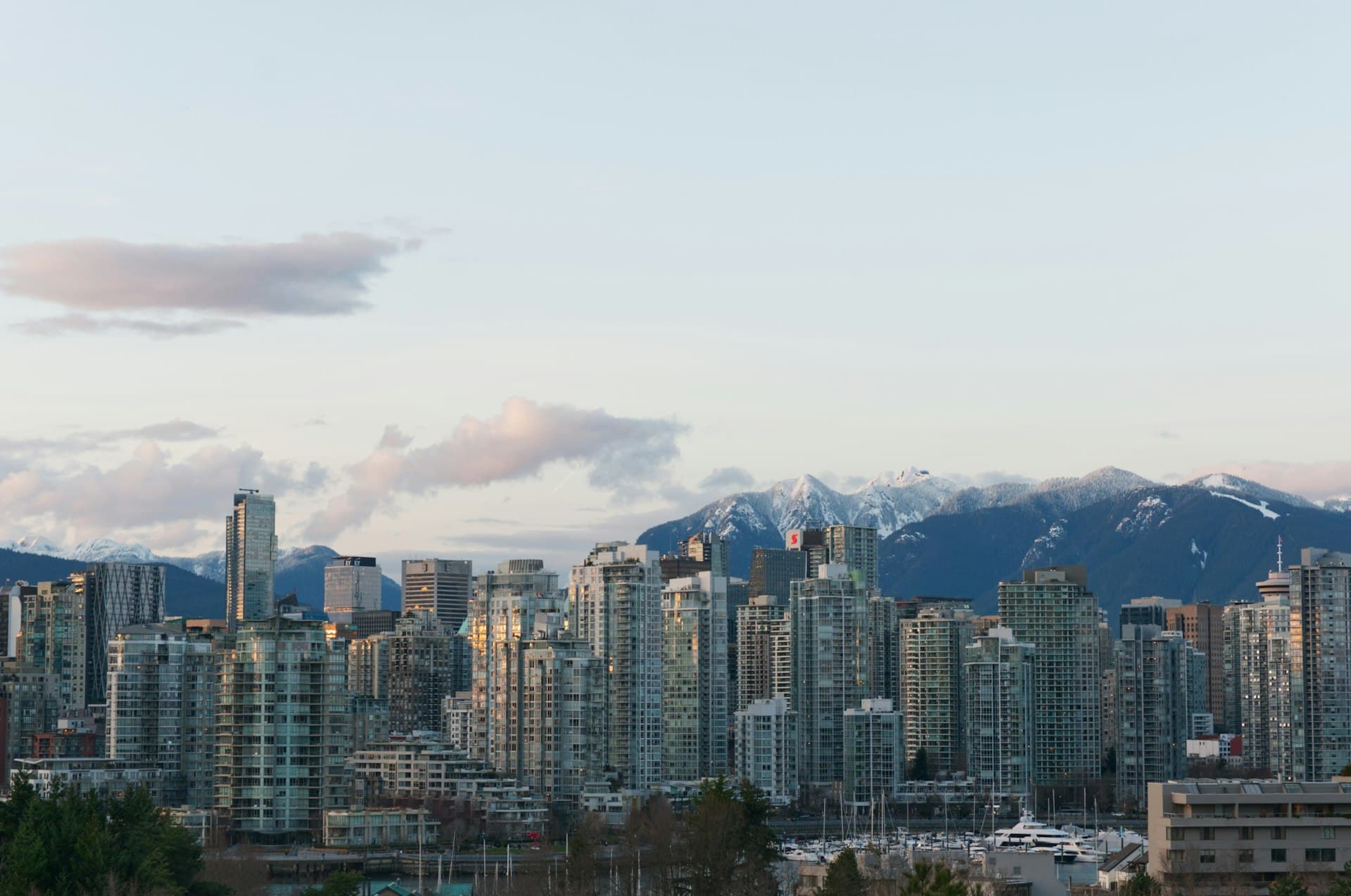 Vancouver downtown skyline with North Shore mountains — luxury chauffeur service